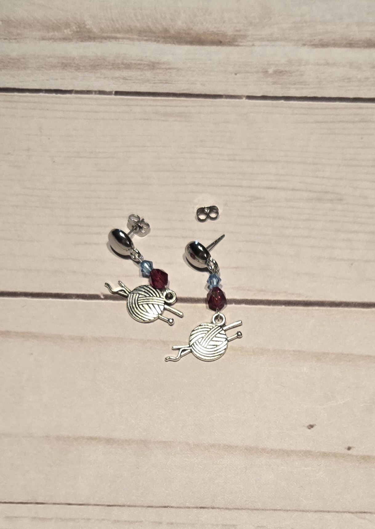 Earrings: Studs: Fiber Arts: Knitting needles with a ball of yarn with Red and Blue Crystals