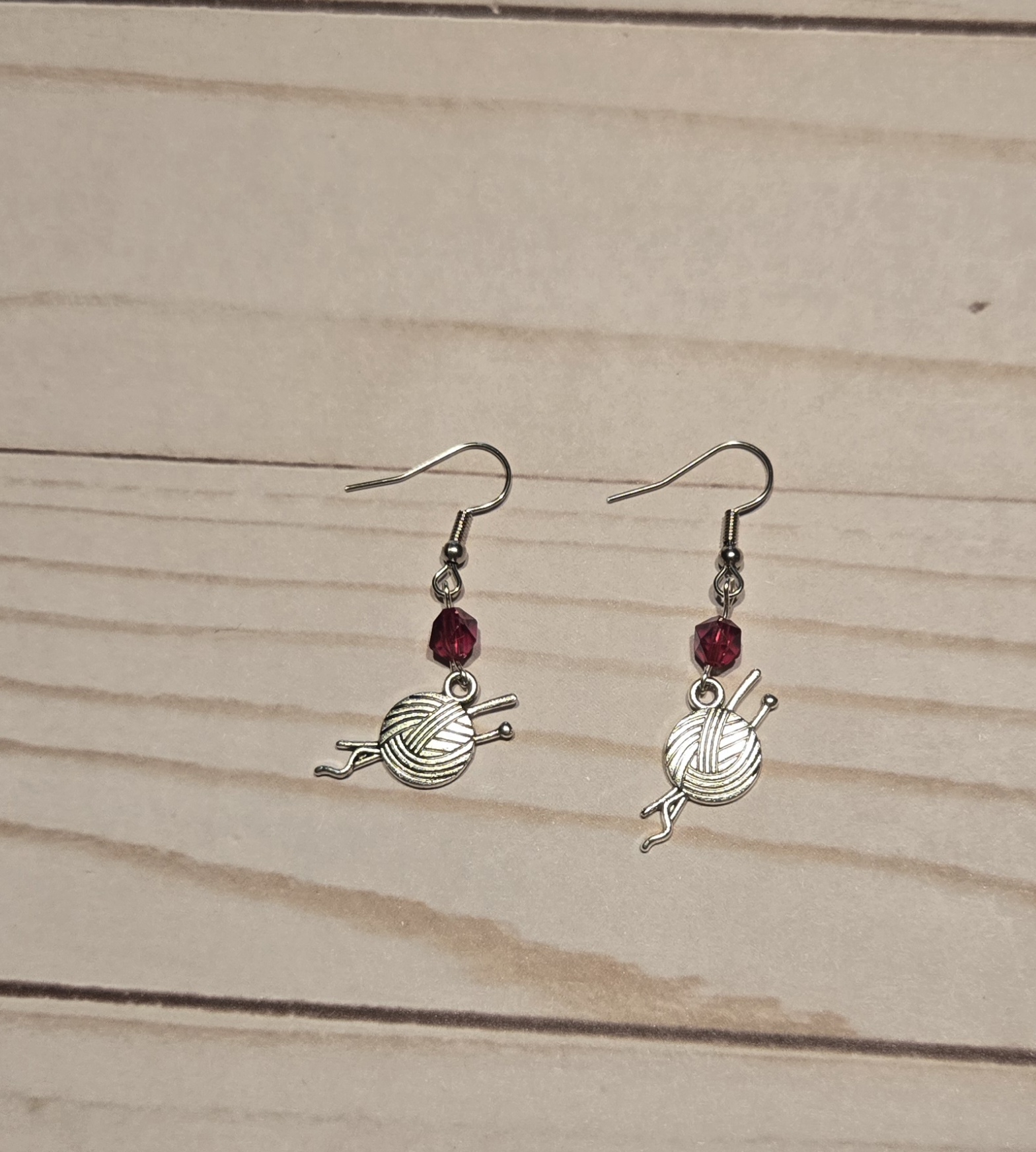 Earrings: hook: Fiber Arts: Knitting needles with a ball of yarn with Red Crystals