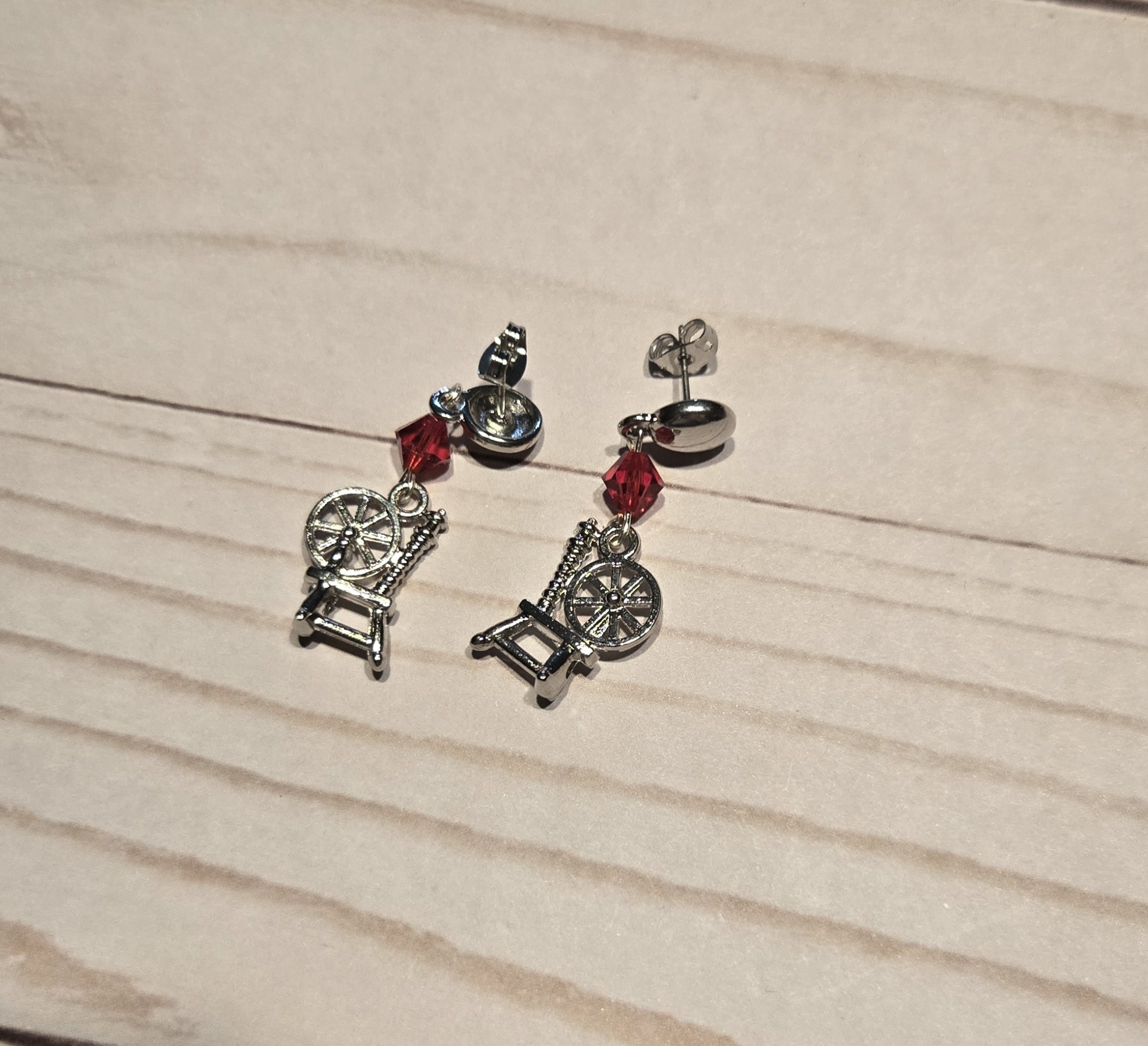 Earrings: Studs: Fiber Arts: Spinning Wheel with Red Crystals